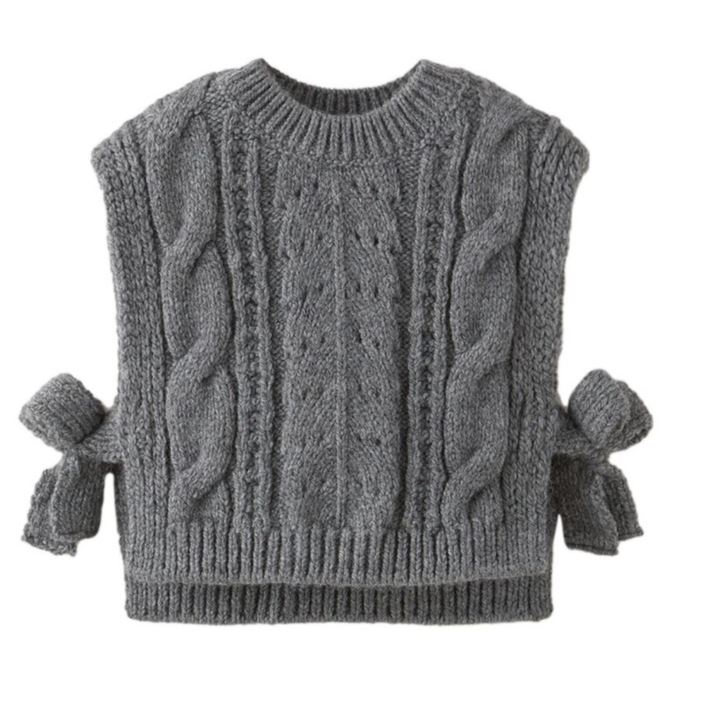 Baby knit vest . Cover all . Ties on the sides . Brand new